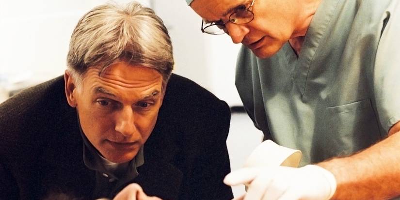 Mark Harmon as Gibbs and David McCallum as Ducky inspect a crime scene in NCIS