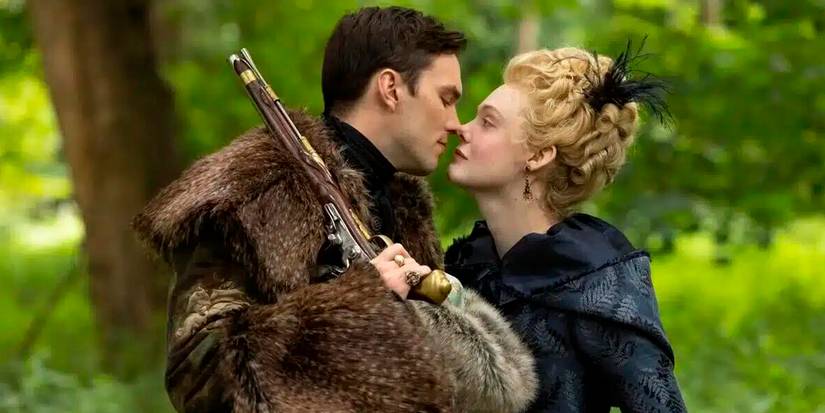 Peter (Nicholas Hoult) and Catherine (Elle Fanning) about to kiss in a woodland in The Great.