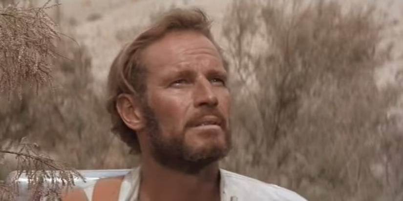 Charlton Heston as George Taylor looking into the distance in Planet of the Apes (1968)