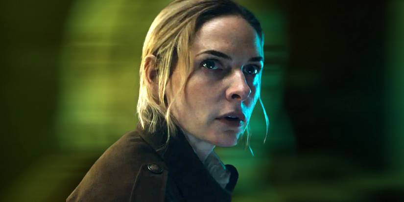 Rebecca Ferguson as Juliette looking surprised against a blurry green background in Silo