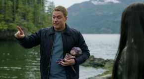 Harry Vanderspeigle holding a baby alien and pointing his finger in Resident Alien season 3 episode 8
