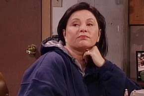 Roseanne looks off in the distance in the season 9 finale.
