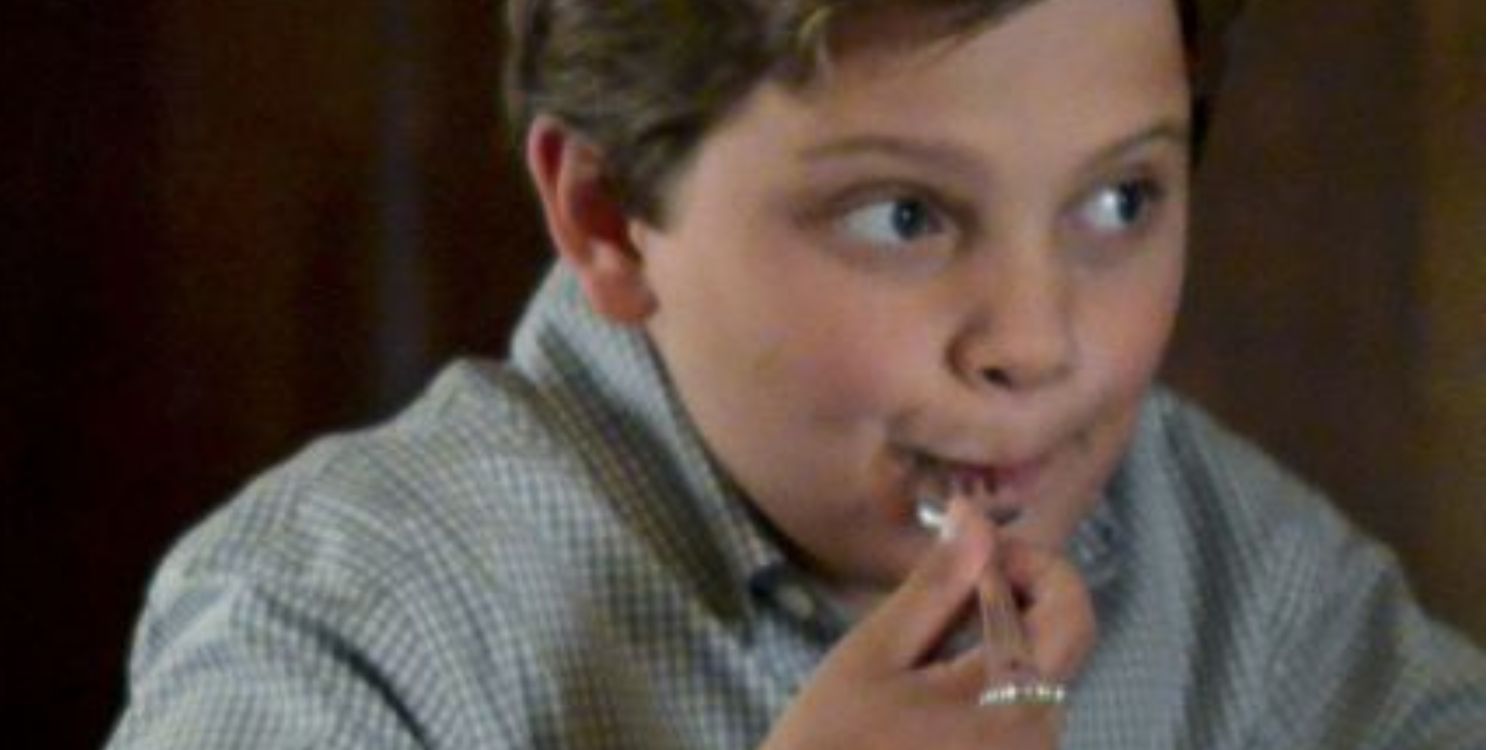 Blue Bloods Sean as a little boy, sitting with a fork in his mouth at family dinner