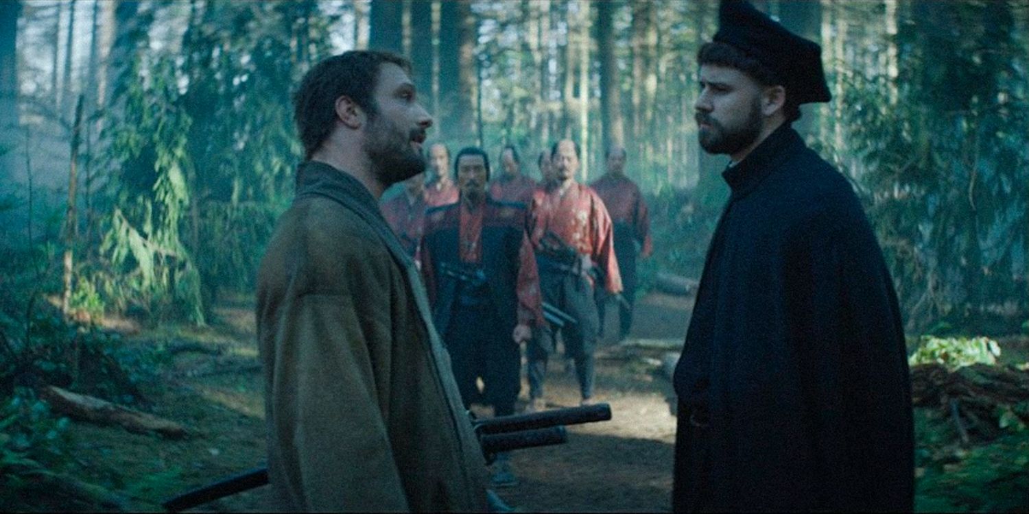 Blackthorne and Father Alvito standing facing each other in the middle of the forest in Shogun season 1 ep 10 (FINALE)