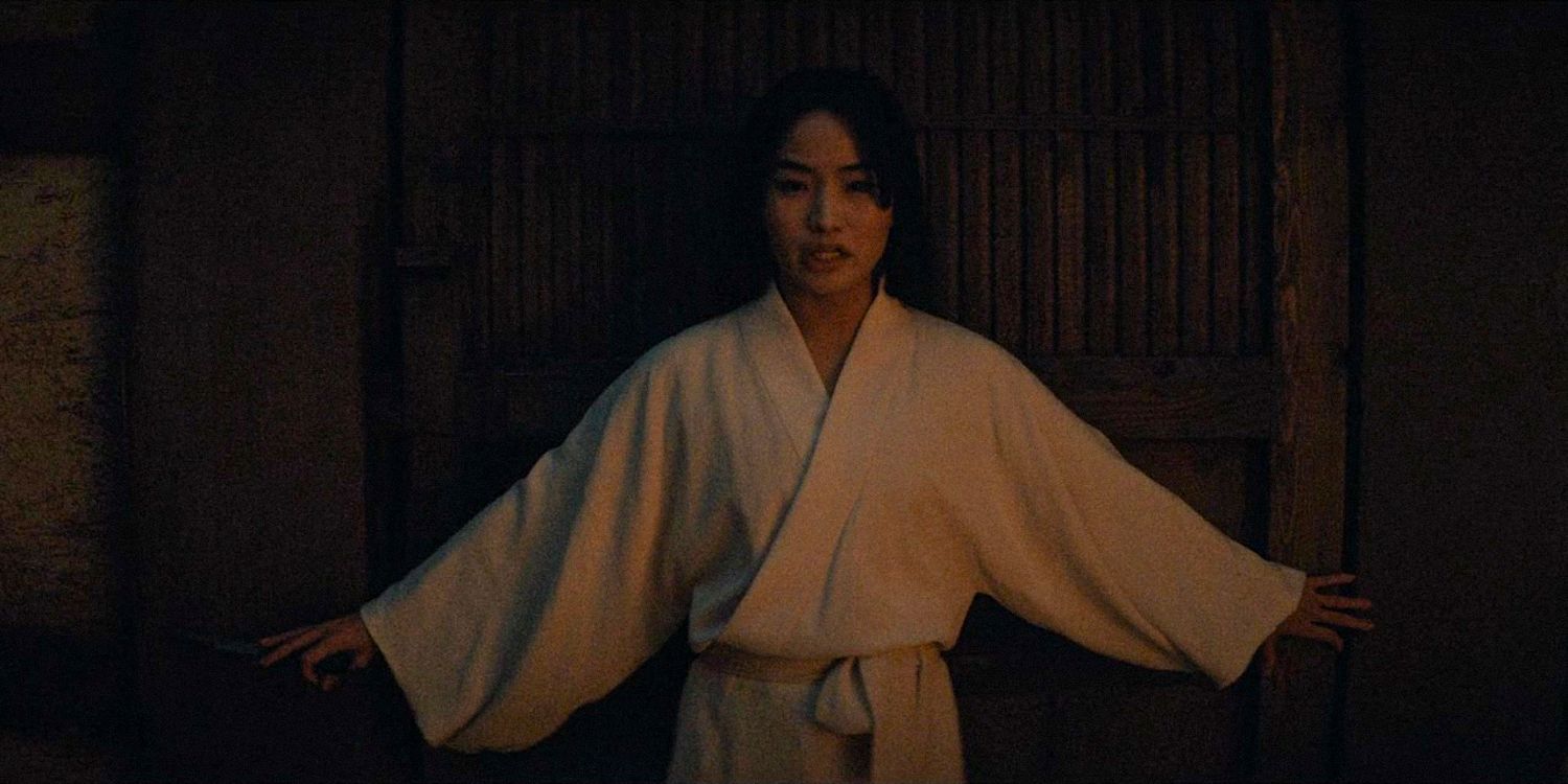 Mariko struggles to hold back a wooden door in Shogun season 1 Ep 9 