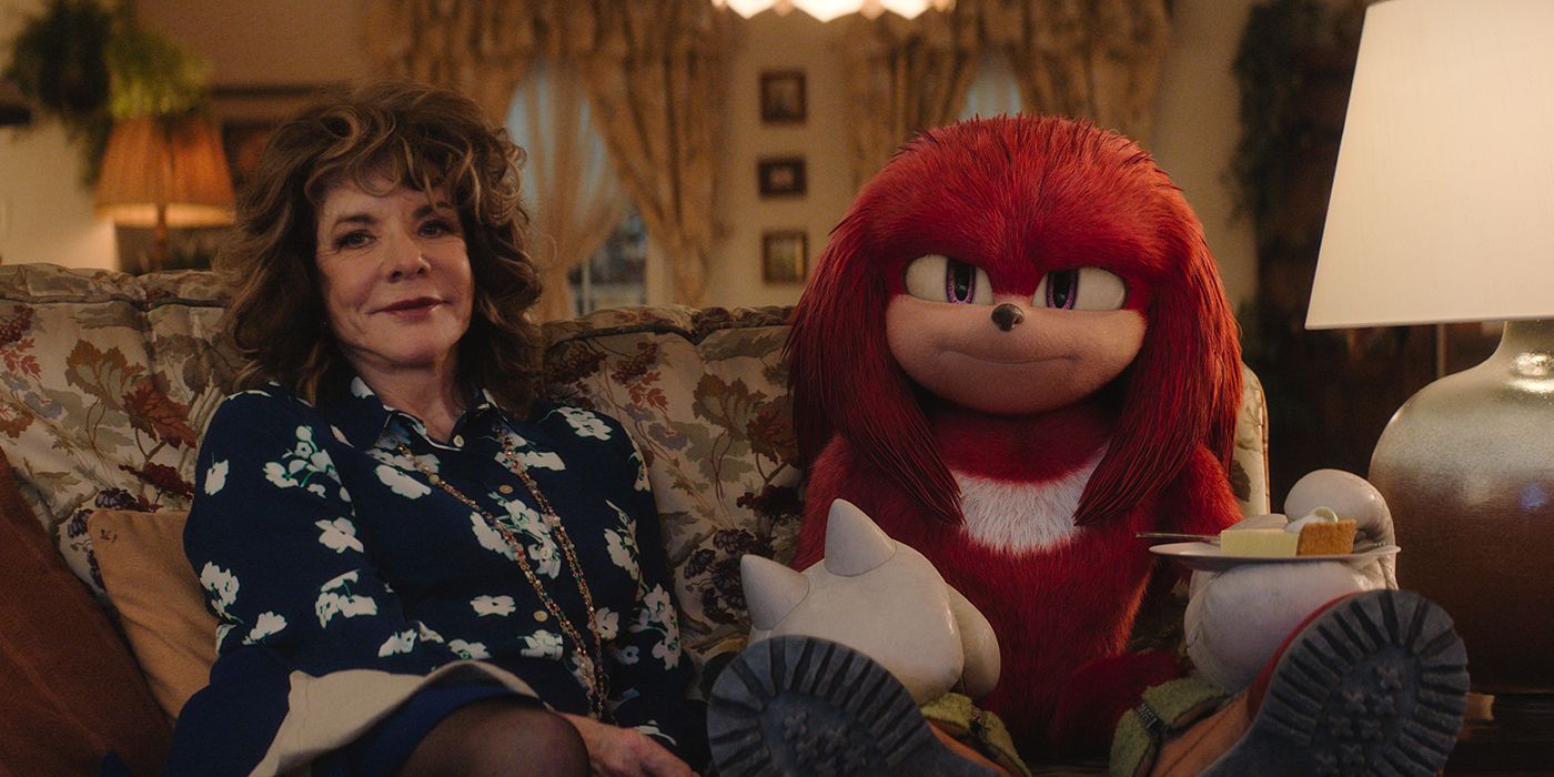 Stockard Channing as Wendy sitting happily with Knuckles in Knuckles