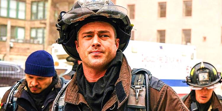 Taylor Kinney as Severide looking at a dangerous scene with a concerned expression in Chicago Fire