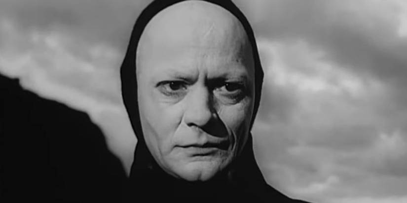 A man in a black hooded cloak in The Seventh Seal (1957)