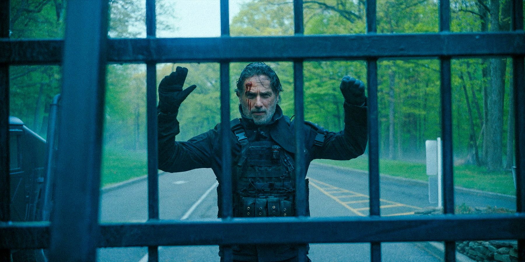 Rick with his hands raised at the entrance of the Cascadia base in The Walking Dead the Ones Who Live season 1 Ep 6