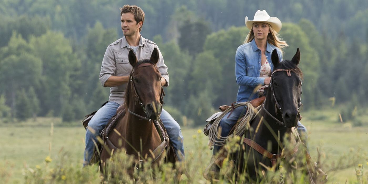 Ty (Graham Wardle) and Amy Fleming (Amber Marshall) riding horses and laughing in Heartland.