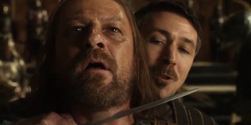 Petyr "Littlefinger" Baelish (Aidan Gillen) with a knife around Ned Stark's (Sean Bean) throat in Game of Thrones