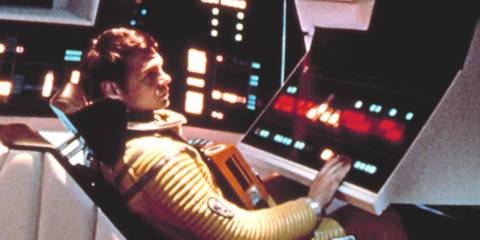 Dr Frank Poole wearing a yellow astronaut suit in 2001: A Space Odyssey (1968)