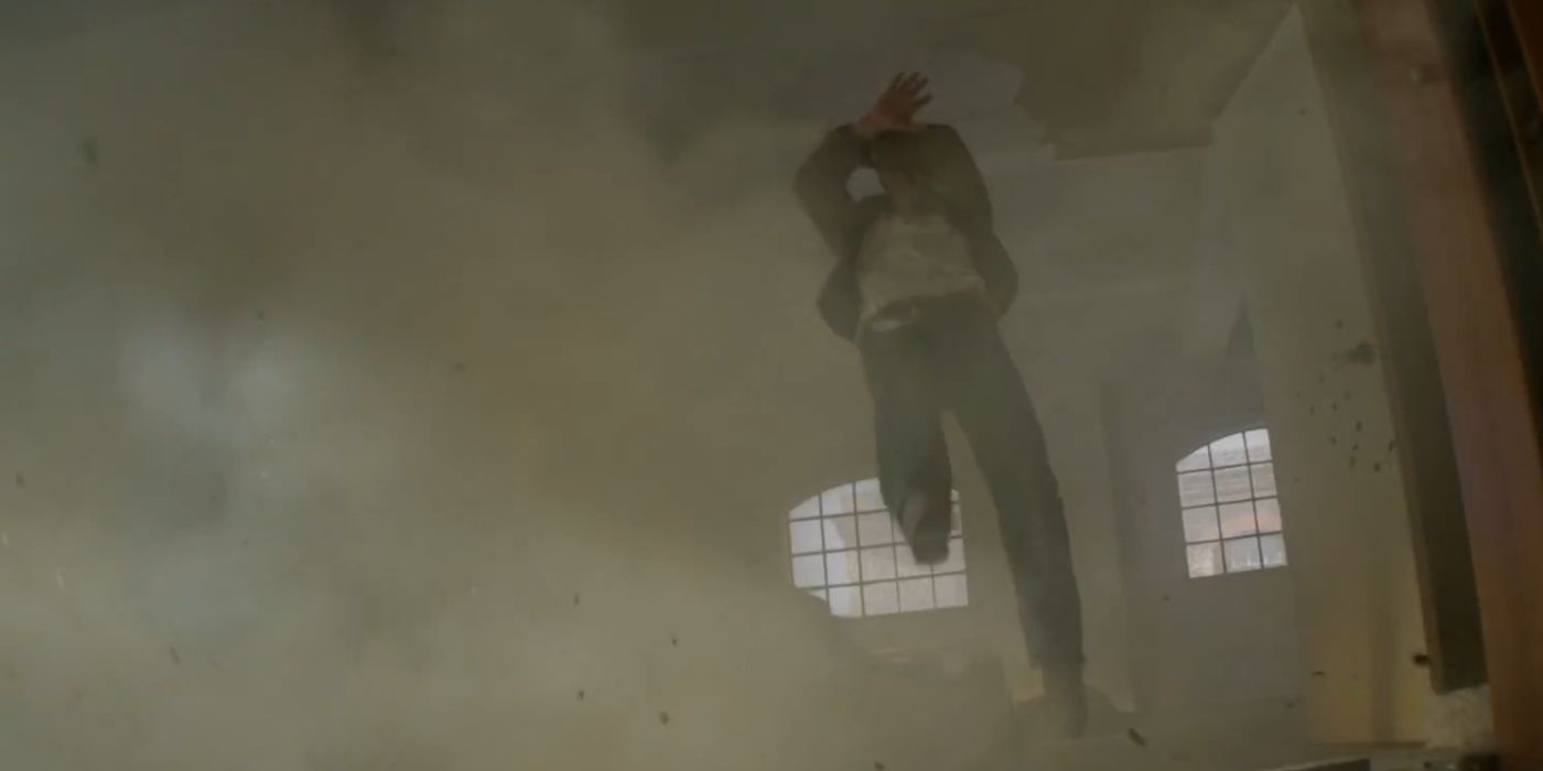 Aidan being thrown across the room after an explosion in Argylle