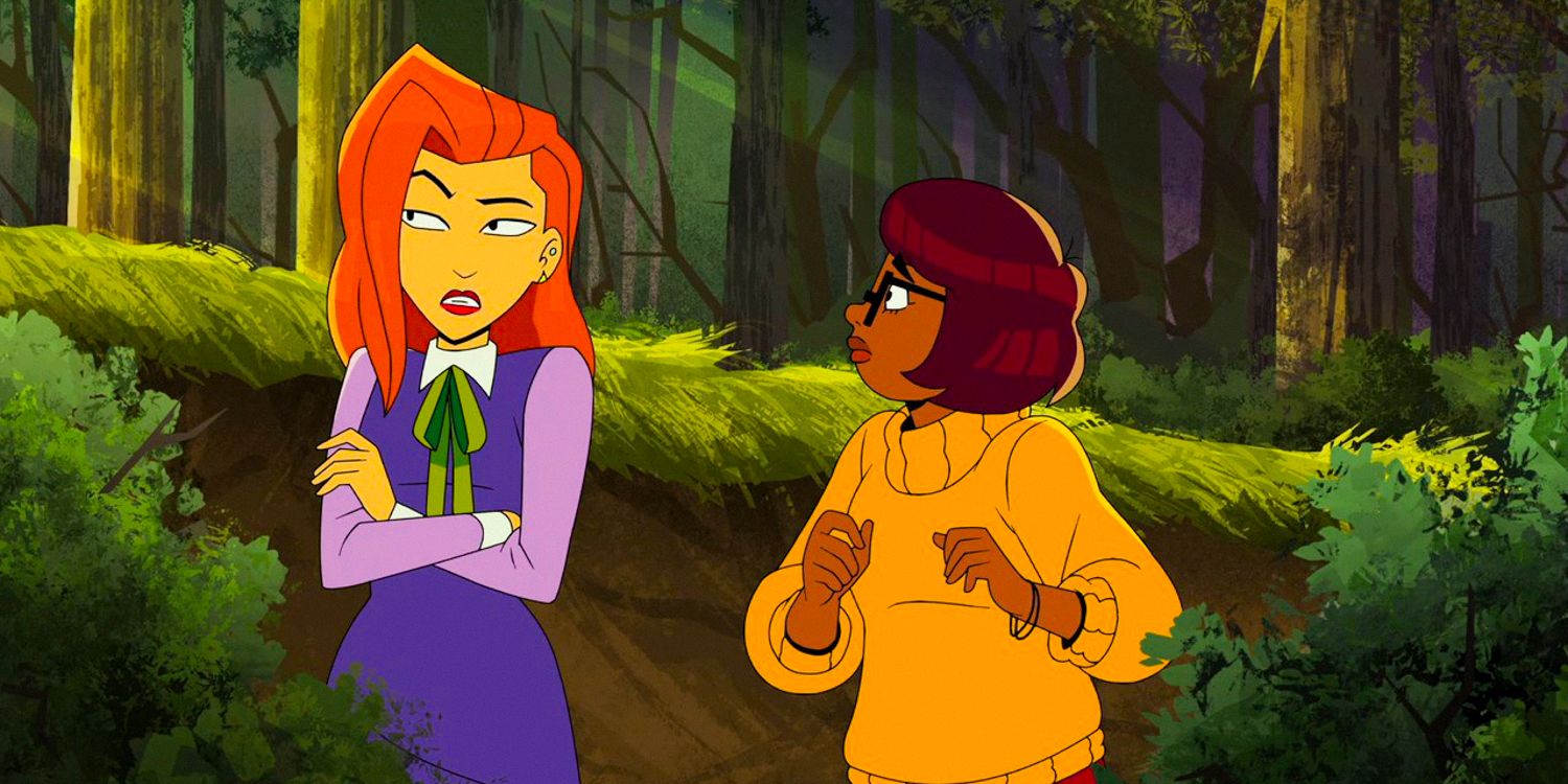 Daphne looks angry while Velma looks on as they walk through the woods in Velma season 2 ep 1