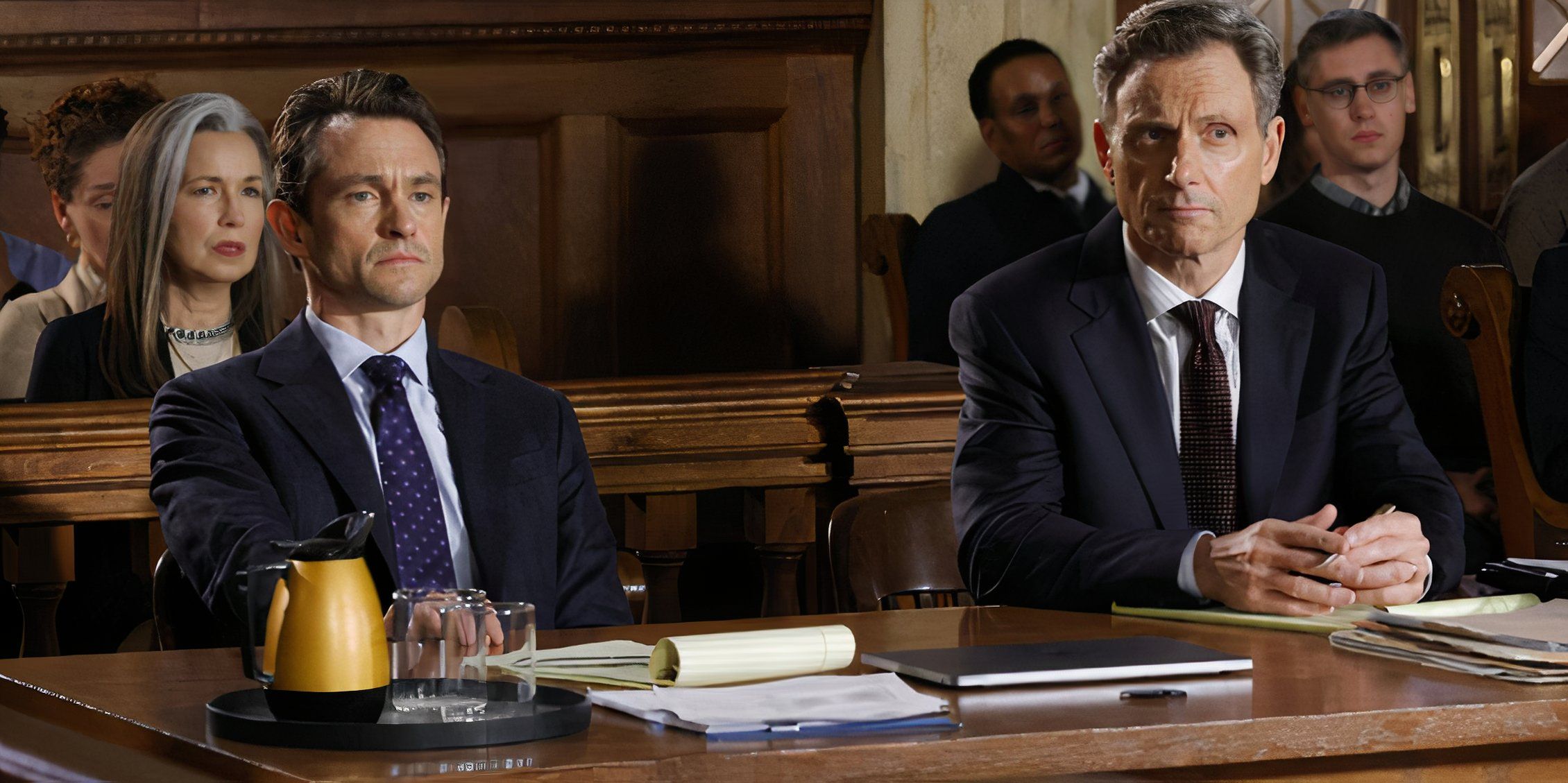 Law & Order Price and Baxter sit together at the defense table
