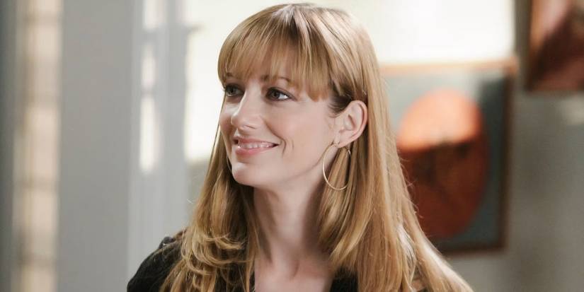 Judy Greer smiling as Denise in Modern Family