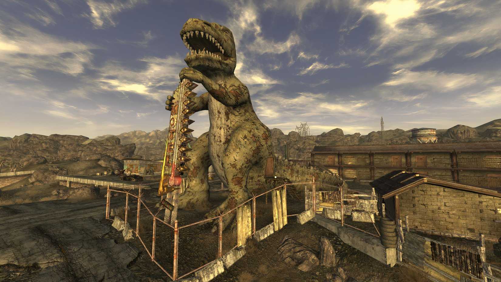 Ein Blick auf Novac mit der prominenten Statue von Dinky, dem T-Rex, in einem Screenshot aus Fallout New Vegas.