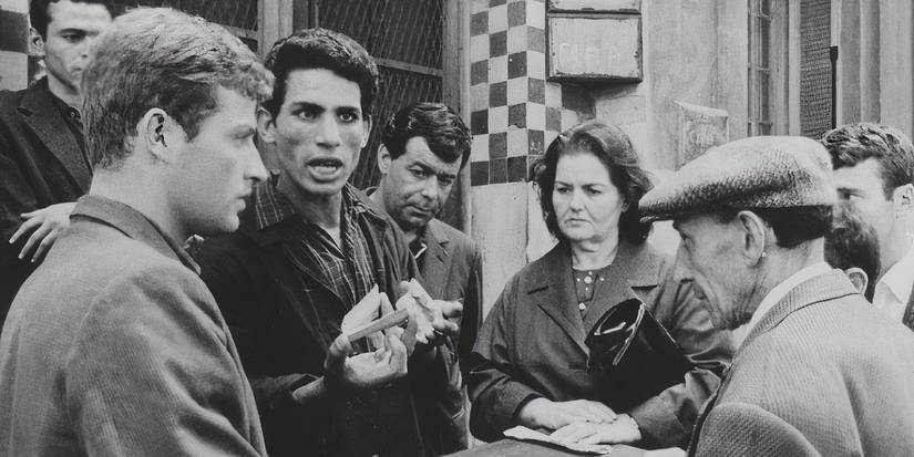 Ali La Pointe (Brahim Haggiag) speaking to a group of rebels in The Battle of Algiers.