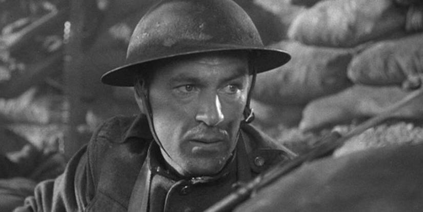 Alvin York (Gary Cooper) looking nervously over a trench in Sergeant York.-1