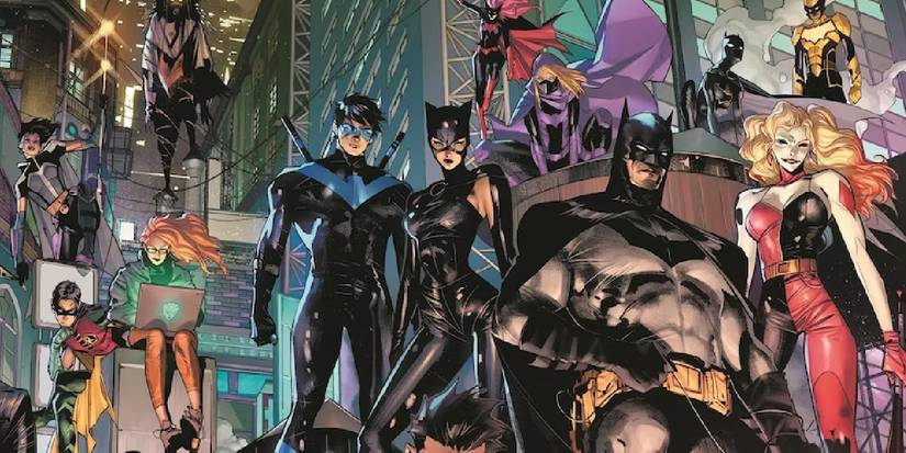  the Bat-Family stands on a rooftop, including Batman, Catwoman, Nightwing, Spoiler, and more.