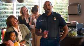 Ben Warren (Jason George) gives a toast while Miranda Bailey (Chandra Wilson), Pru, Maya Bishop and Carina DeLuca laugh in Station 19