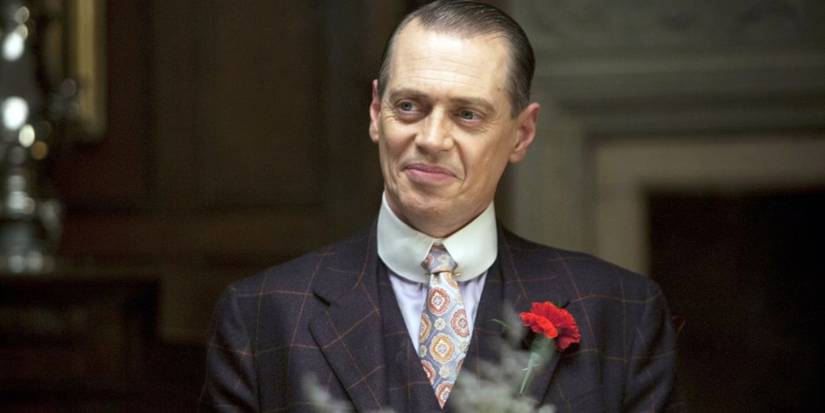 Nucky (Steve Buscemi) smiling at a party in Boardwalk Empire