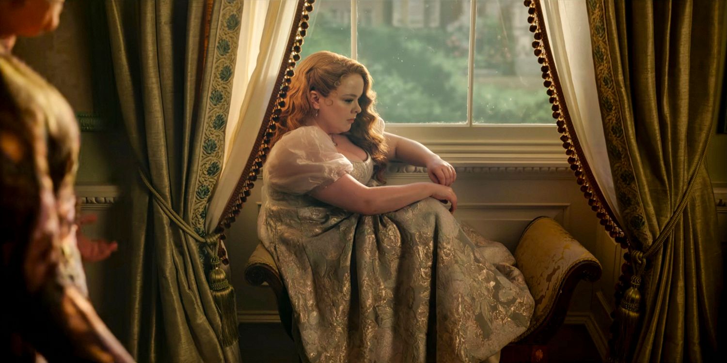 Penelope Featherington (Nicola Coughlan) nostalgic, sitting by the window in Bridgerton season 3 Part 1