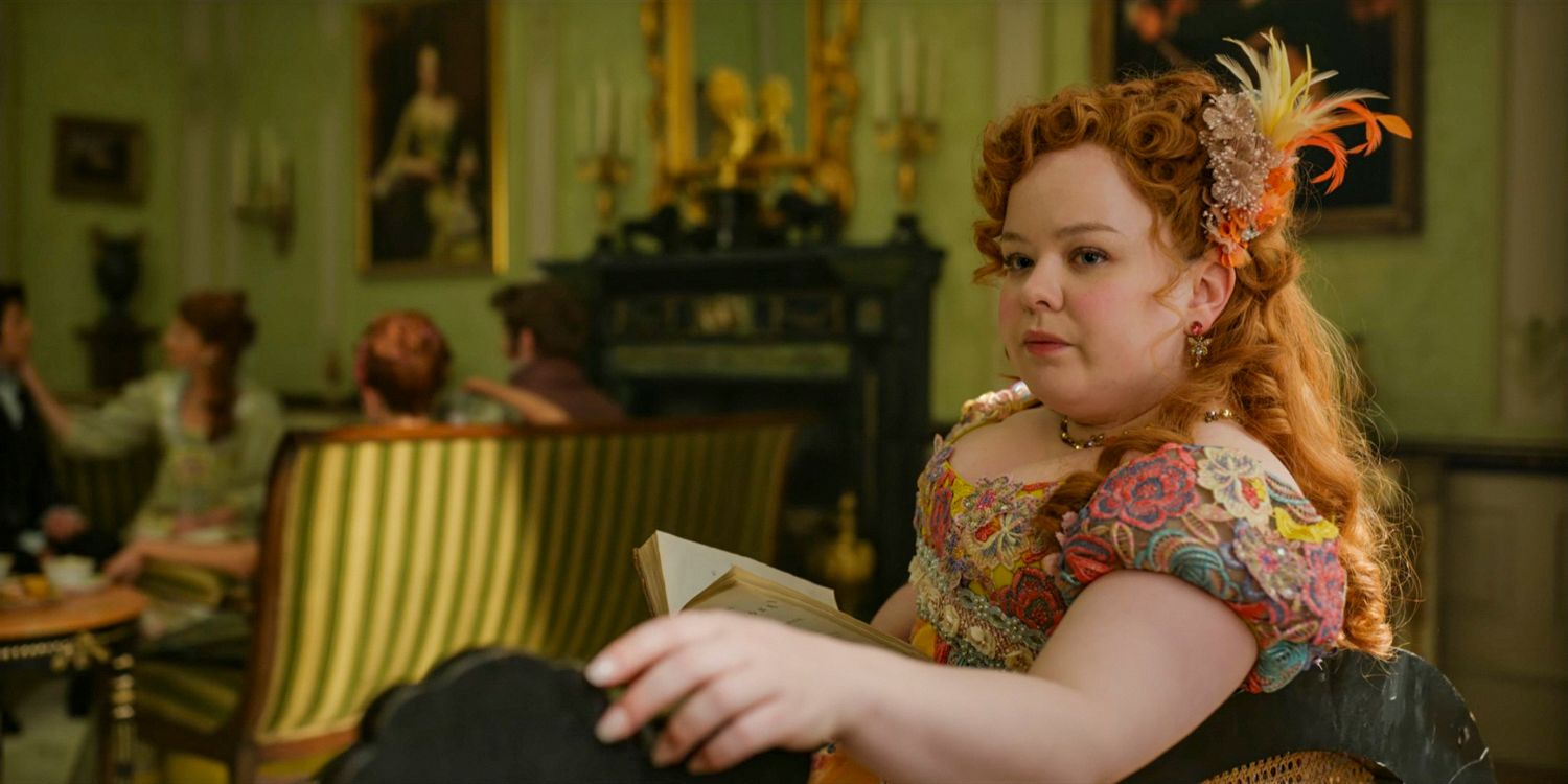 Penelope Featherington (Nicola Coughlan) looking contemplative while reading a book in Bridgerton season 3 Part 1