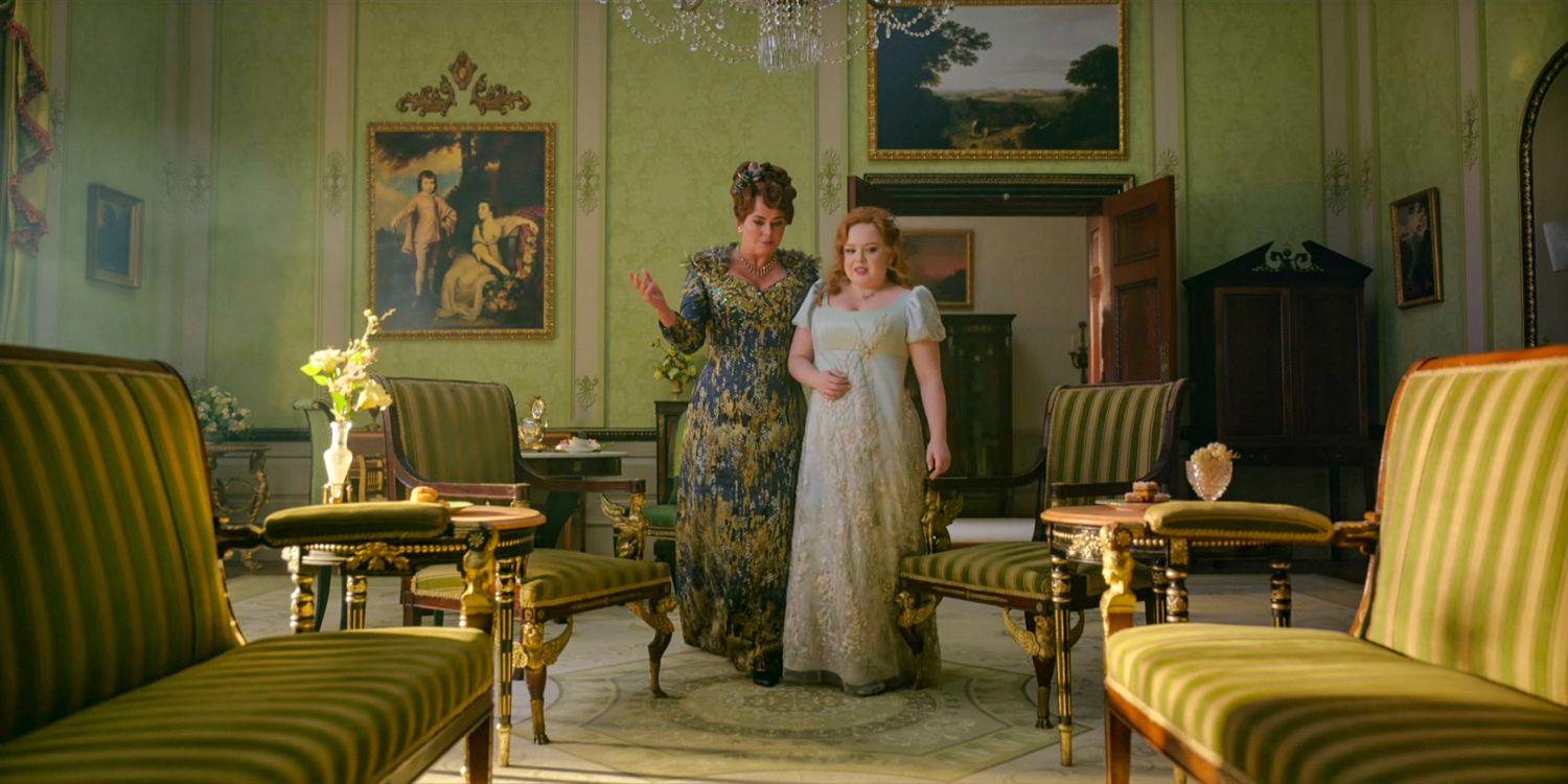 Lady Portia Featherington (Polly Walker) and Penelope Featherington (Nicola Coughlan) chatting in the drawing room in Bridgerton season 3 Part 1