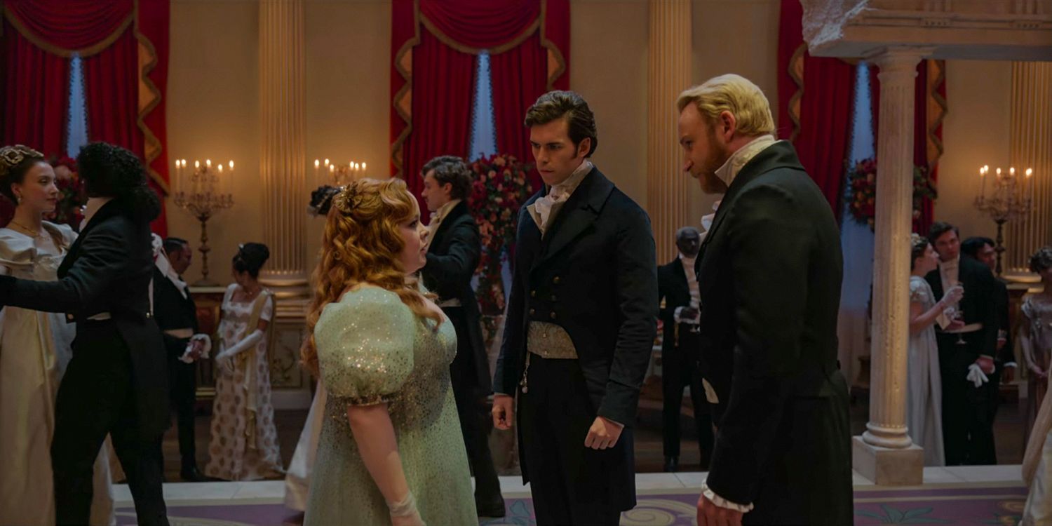 Penelope (Nicola Coughlan) standing in front of Colin Bridgerton (Luke Newton) and Lord Alfred Debling (Sam Phillips) in Bridgerton season 3 Part 1