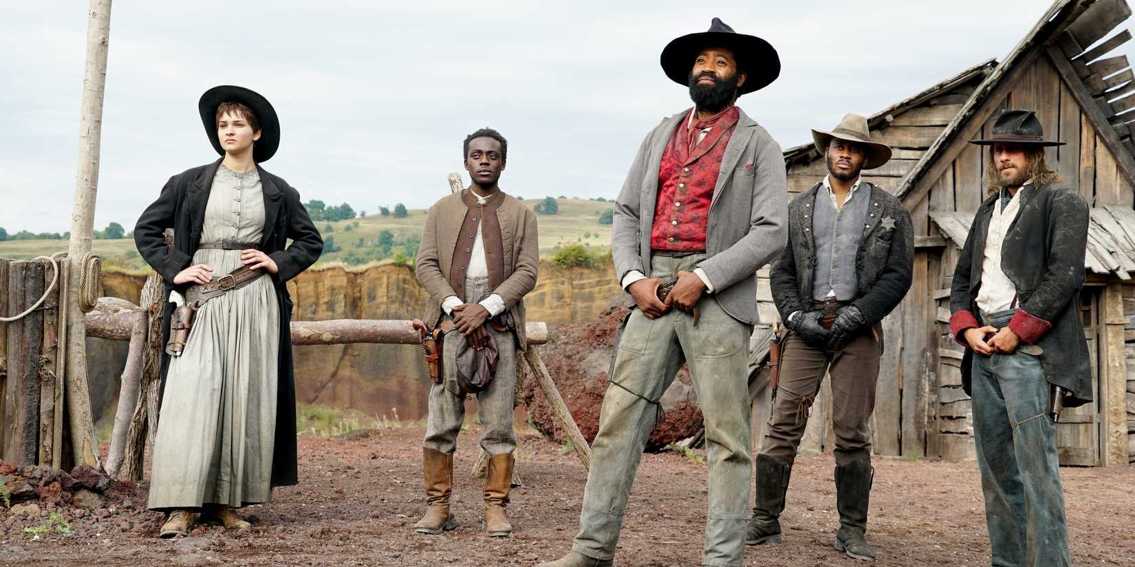 John Ellis (Nicholas Pinnock) and Sarah (Lisa Vicari) standing in a yard in Django