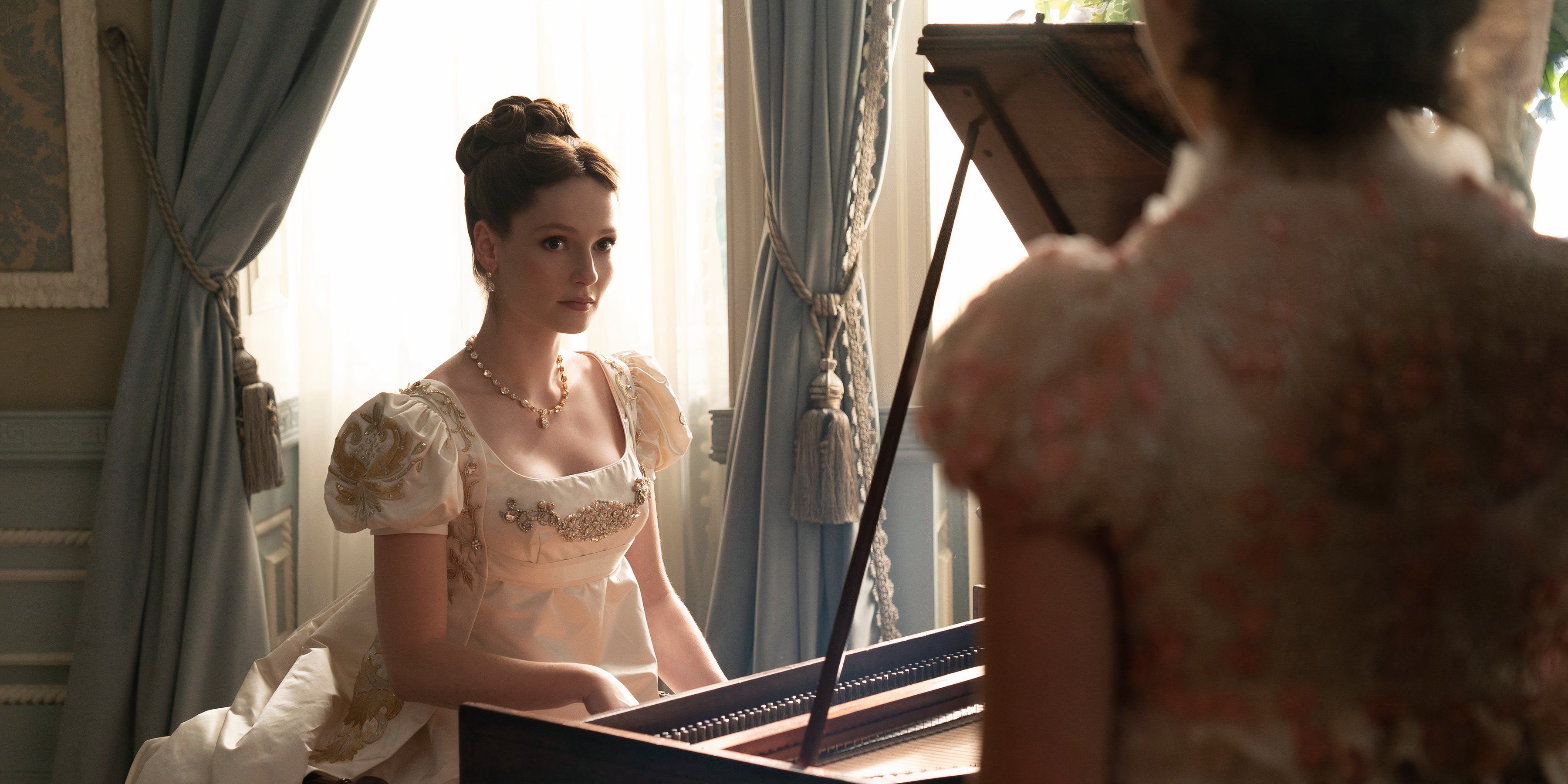 francesca sits behind the piano in bridgerton season 3 still