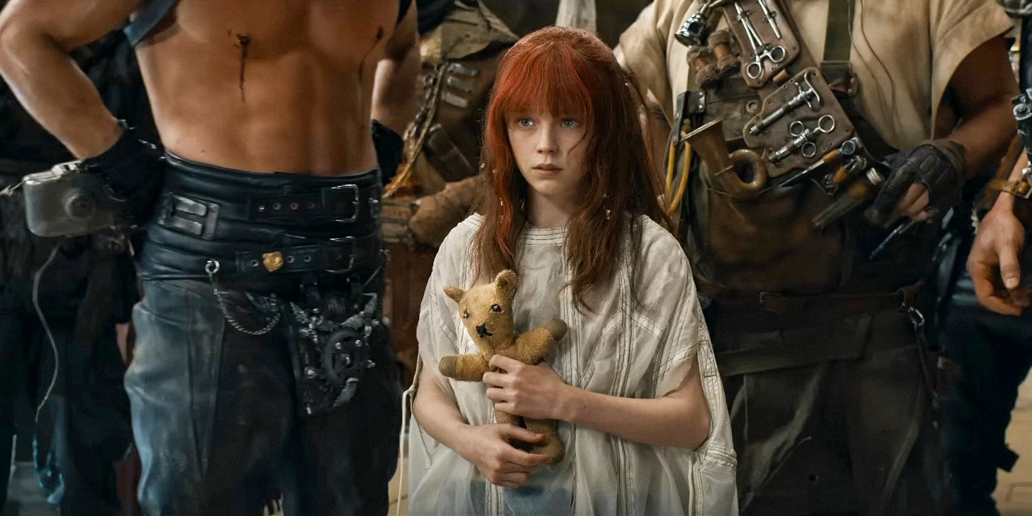 Young Furiosa (Alyla Browne) with Dementus' teddy bear in Furiosa: A Mad Max Saga