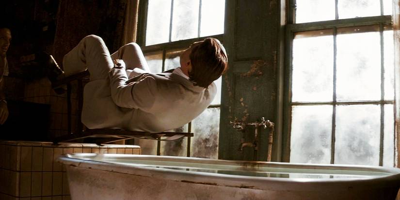 Cobb falling into a tub while dreaming in Inception 