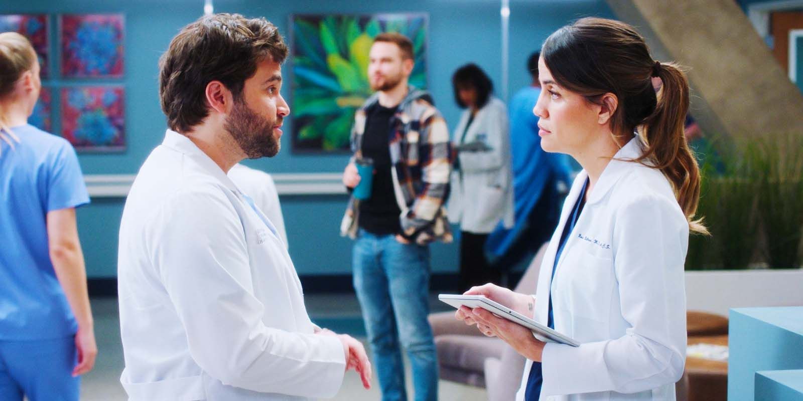 Jake Borelli as Dr. Levi Schmitt and Natalie Morales as Dr. Monica Beltran in Grey's Anatomy season 20, episode 6