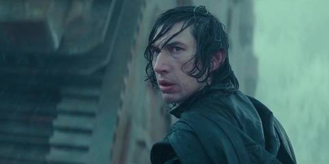 Kylo Ren (Adam Driver) looks over his shoulder in the rain in Star Wars: The Rise of Skywalker