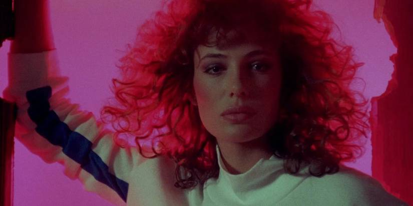 Kelly LeBrock As Lisa against a glowing pink background In Weird Science
