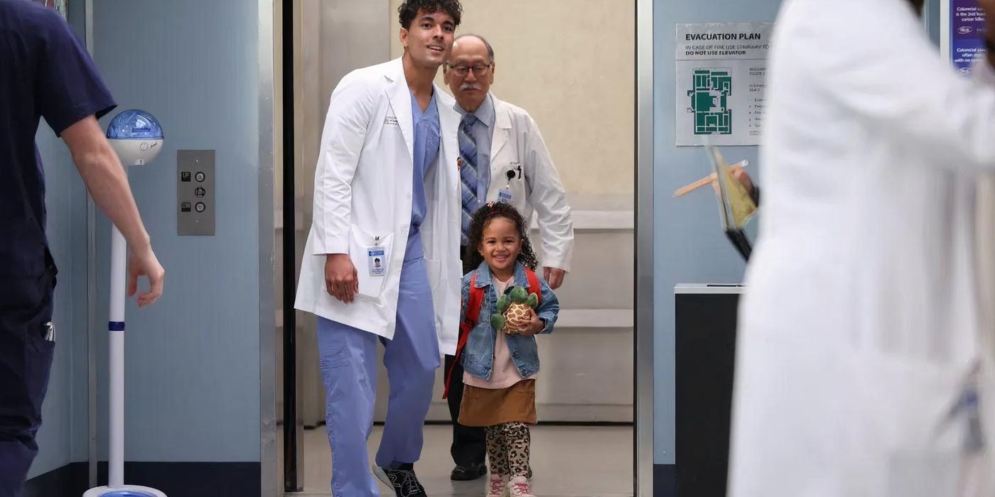 Lucas Adams (Niko Terho) escorts Pru off the elevator at Grey Sloan in Grey's Anatomy