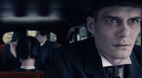 Lurch driving the car with Wednesday in the back.