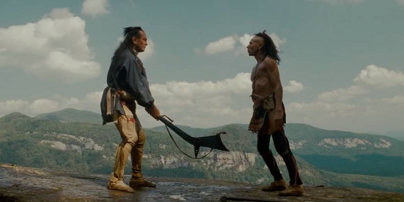 Two men stand across from each other in The Last of the Mohicans