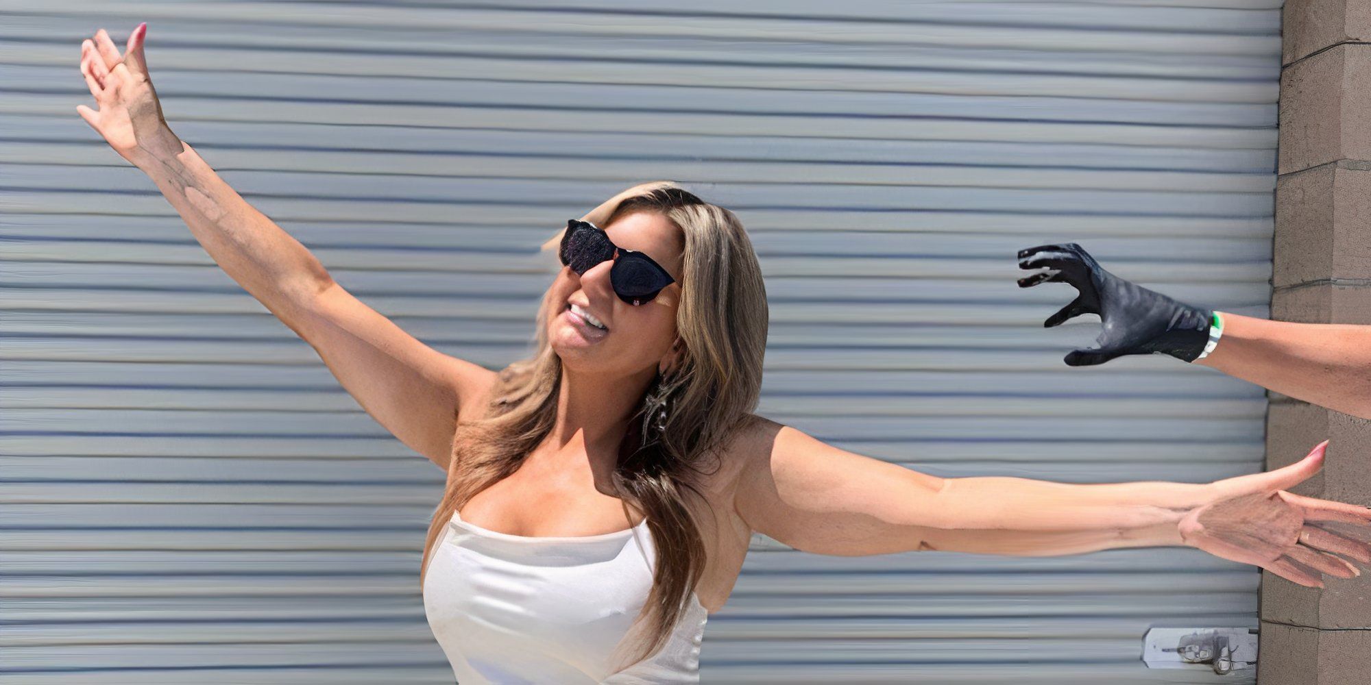 Storage Wars star Brandi Passante doing a flying pose with a gloved hand pretending to grab her