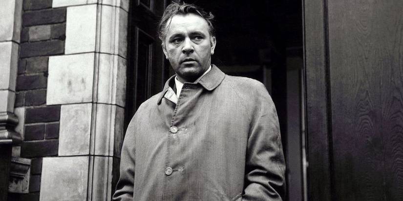 Richard Burton stands in a doorway in The Spy Who Came in from the Cold