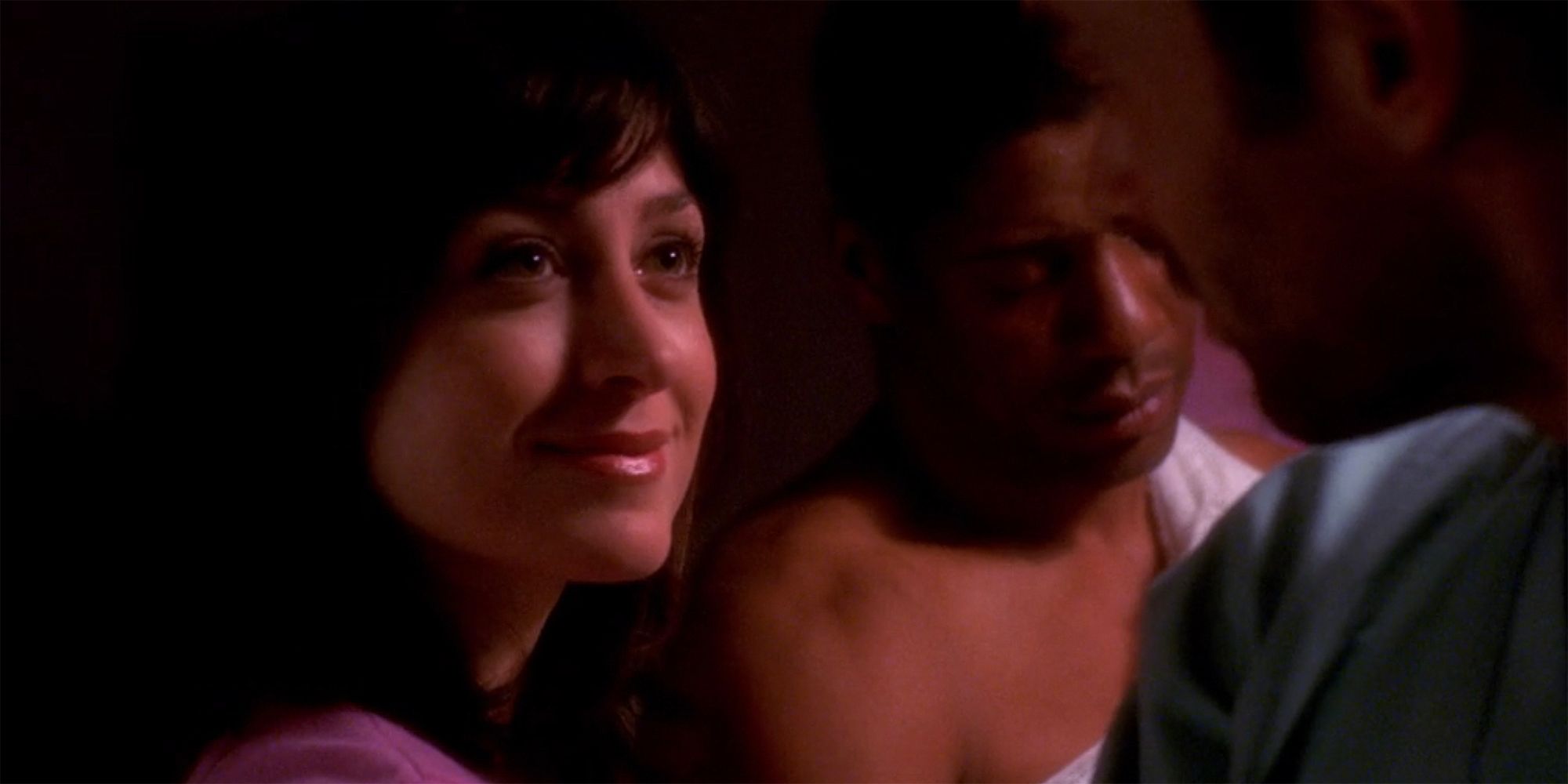 A close up of Kate with a wounded Gerald in the background in NCIS