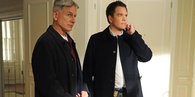 Mark Harmon as Leroy Gibbs and Michael Weatherly as Tony DiNozzo standing awkwardly together in NCIS