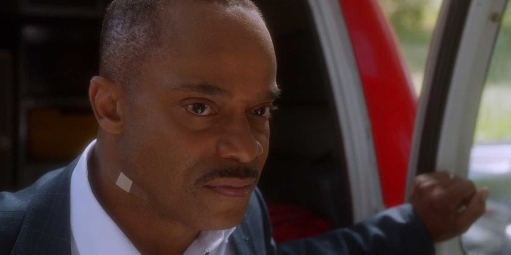 A close up of Rocky Carroll as Leon Vance sporting a band-aid in NCIS