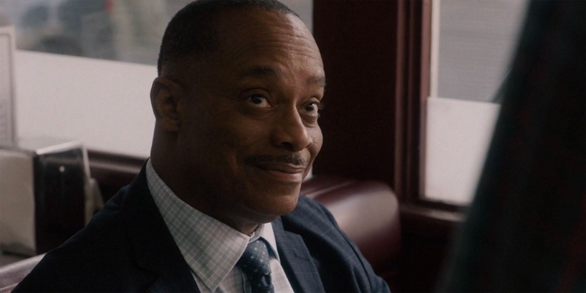 Rocky Carroll as Leon Vance smiling in NCIS