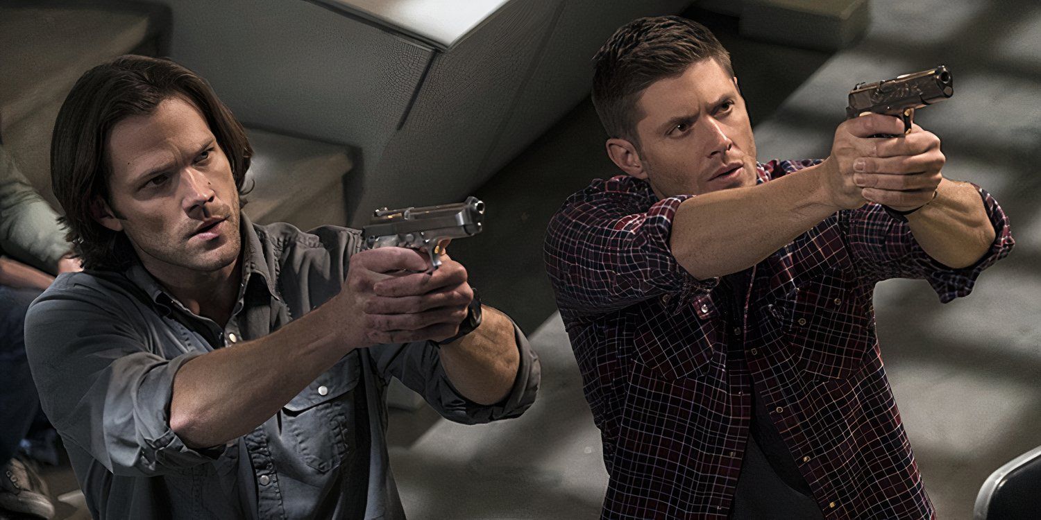 Sam (Jared Padalecki) and Dean Winchester (Jensen Ackles) pointing guns upwards in Supernatural.