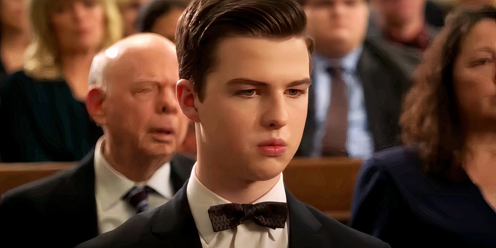 Sheldon wearing a black suit at George's funeral in Young Sheldon