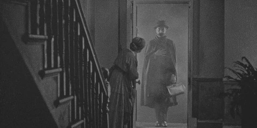 A man in a doorway in The Lodger A Story of the London Fog 1927