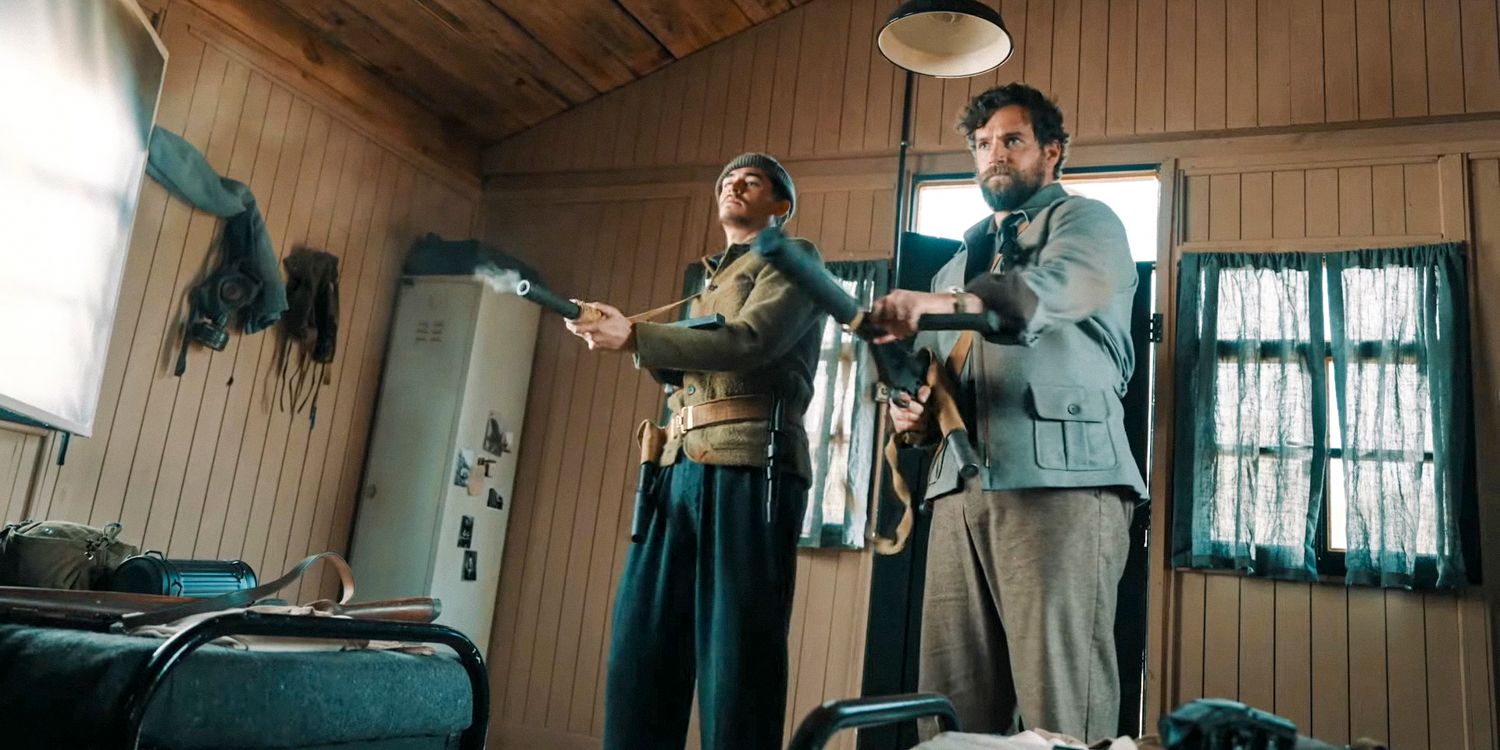 Henry Hayes (Hero Fiennes Tiffin) and Gus March-Phillips (Henry Cavill) firing their weapons in The Ministry of Ungentlemanly Warfare